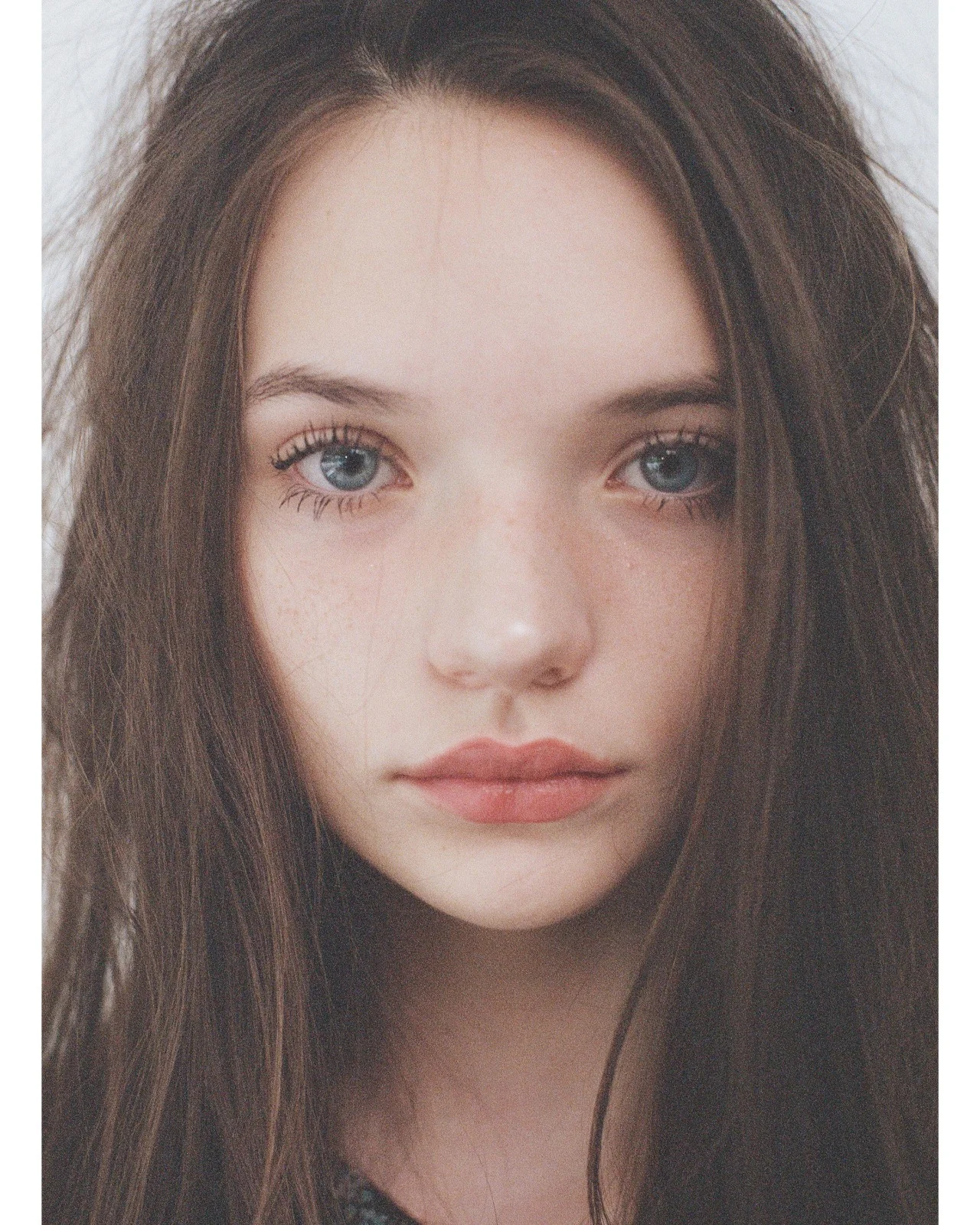Close-up portrait of Ellie with her hair down, looking at the camera